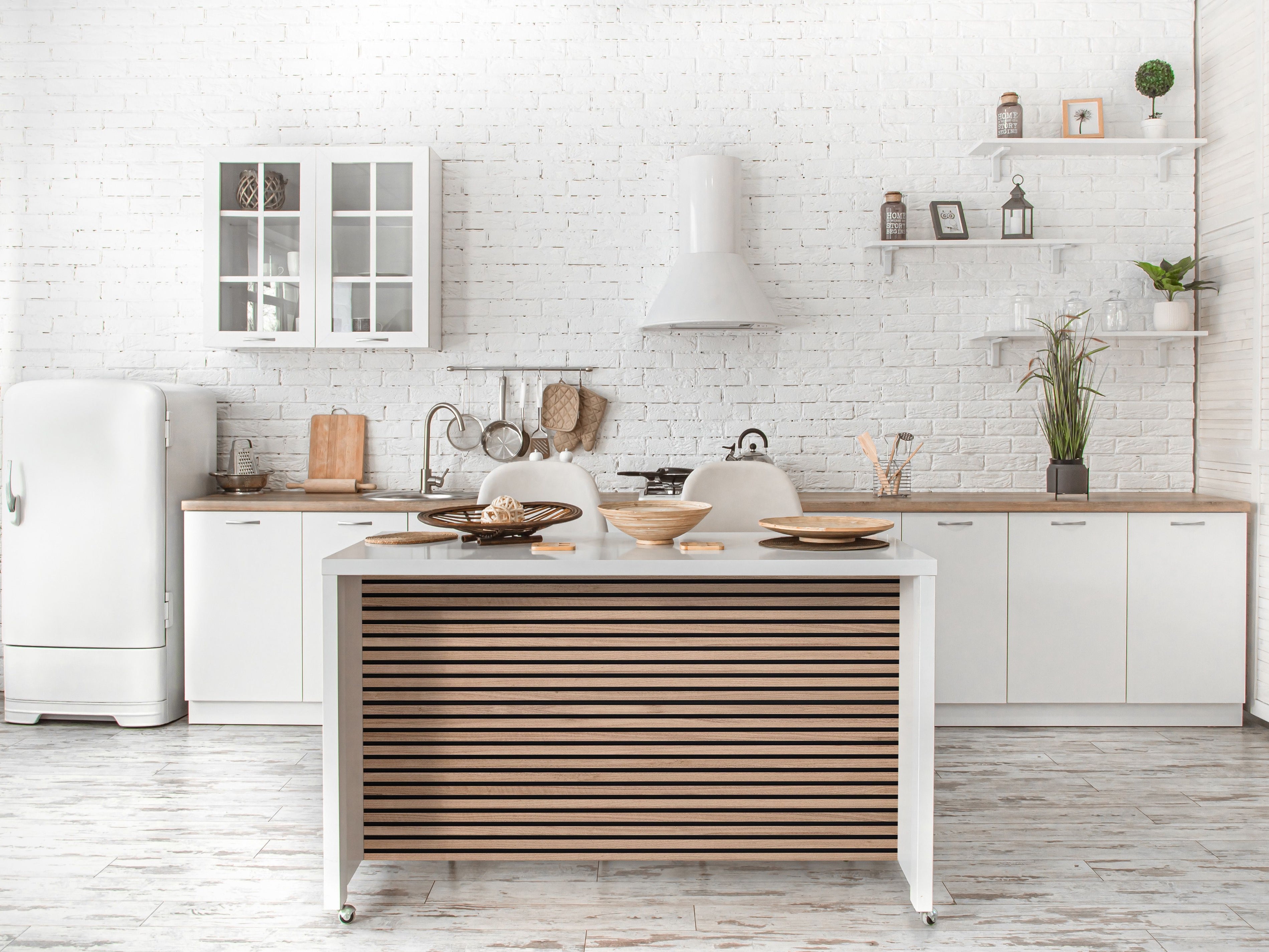 Can wood wall panels be used in bathrooms or kitchens?