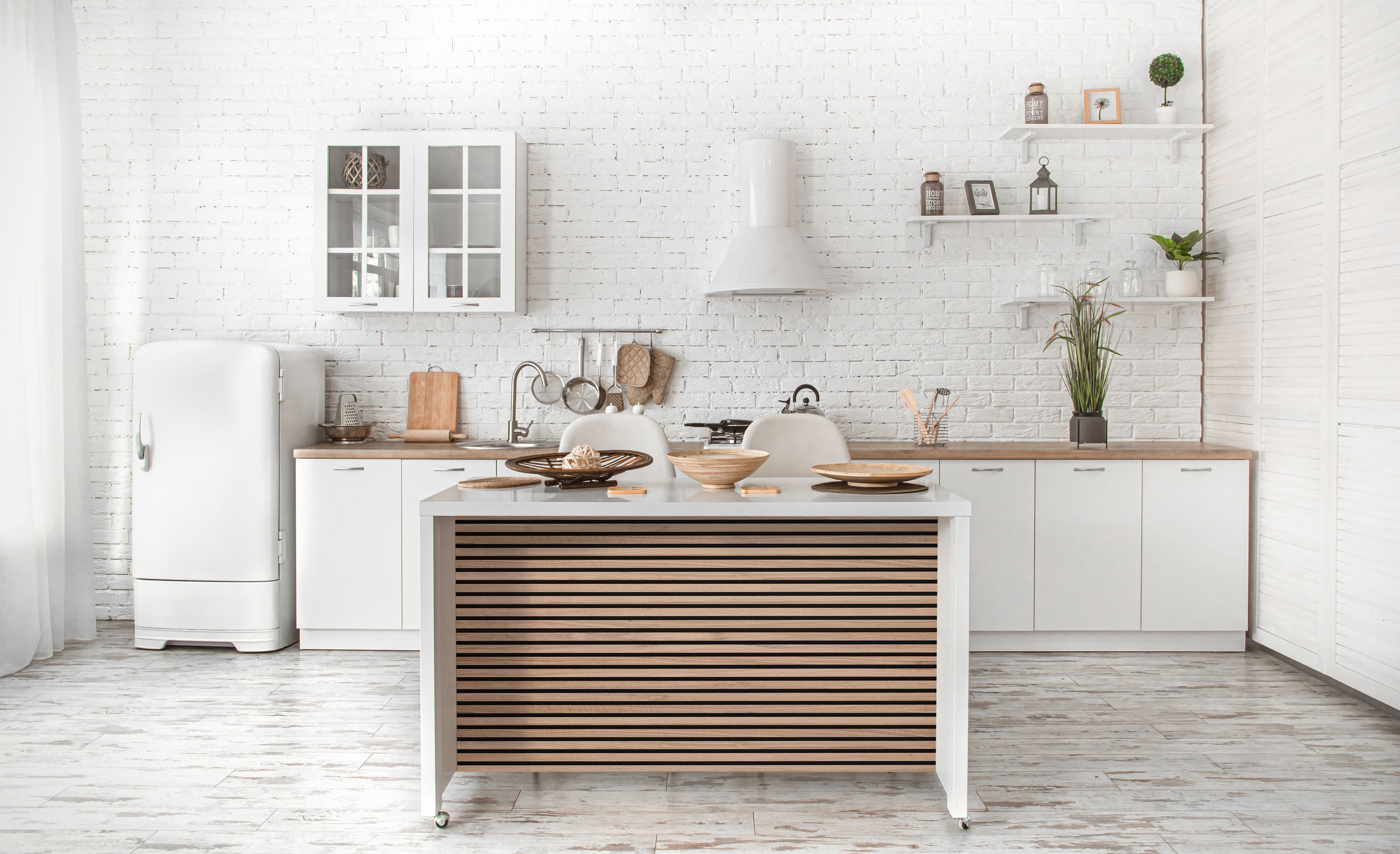 Can wood wall panels be used in bathrooms or kitchens?