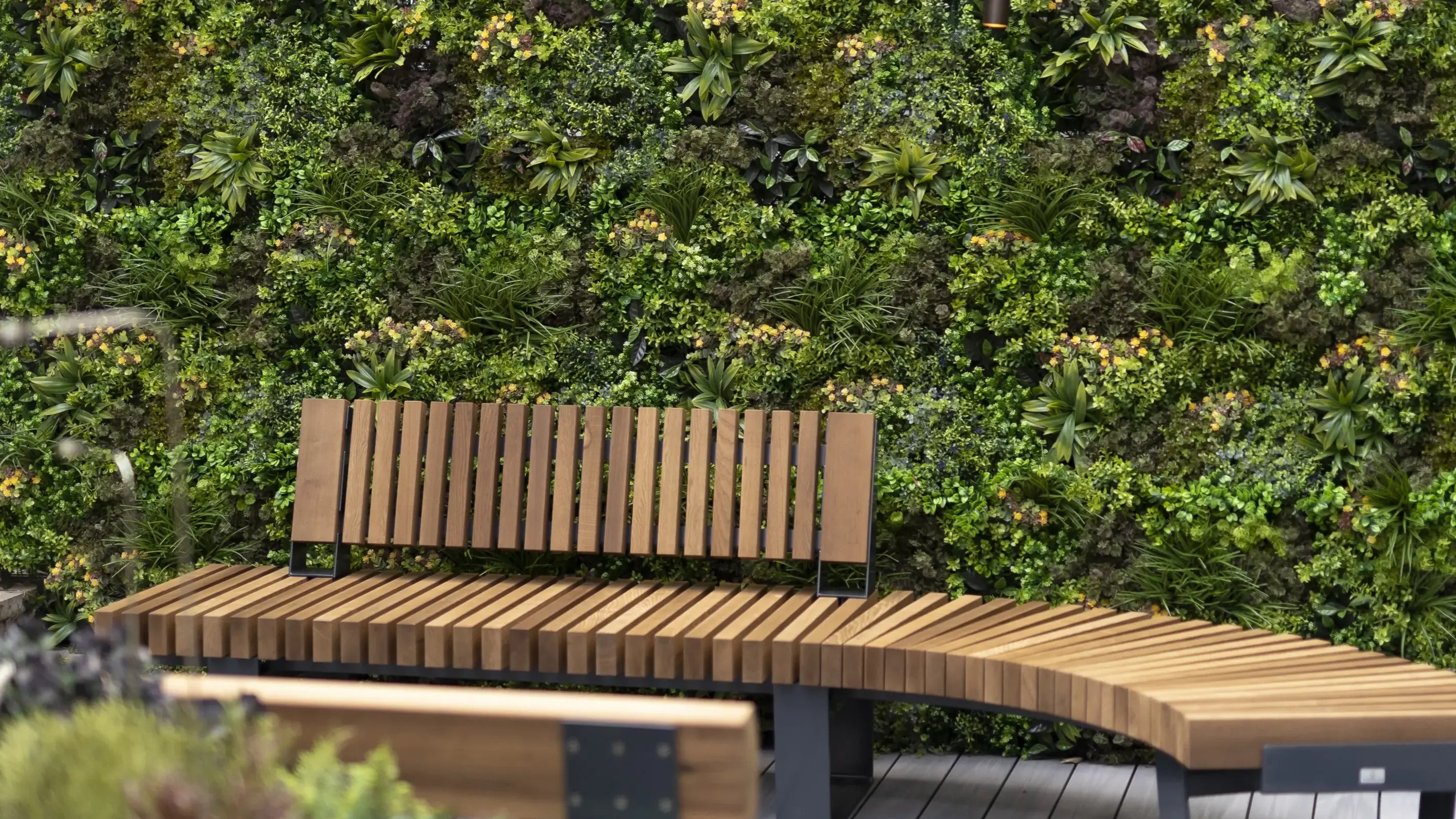 Elevate Your Space with On-Trend Artificial Green Walls and Black Panelling
