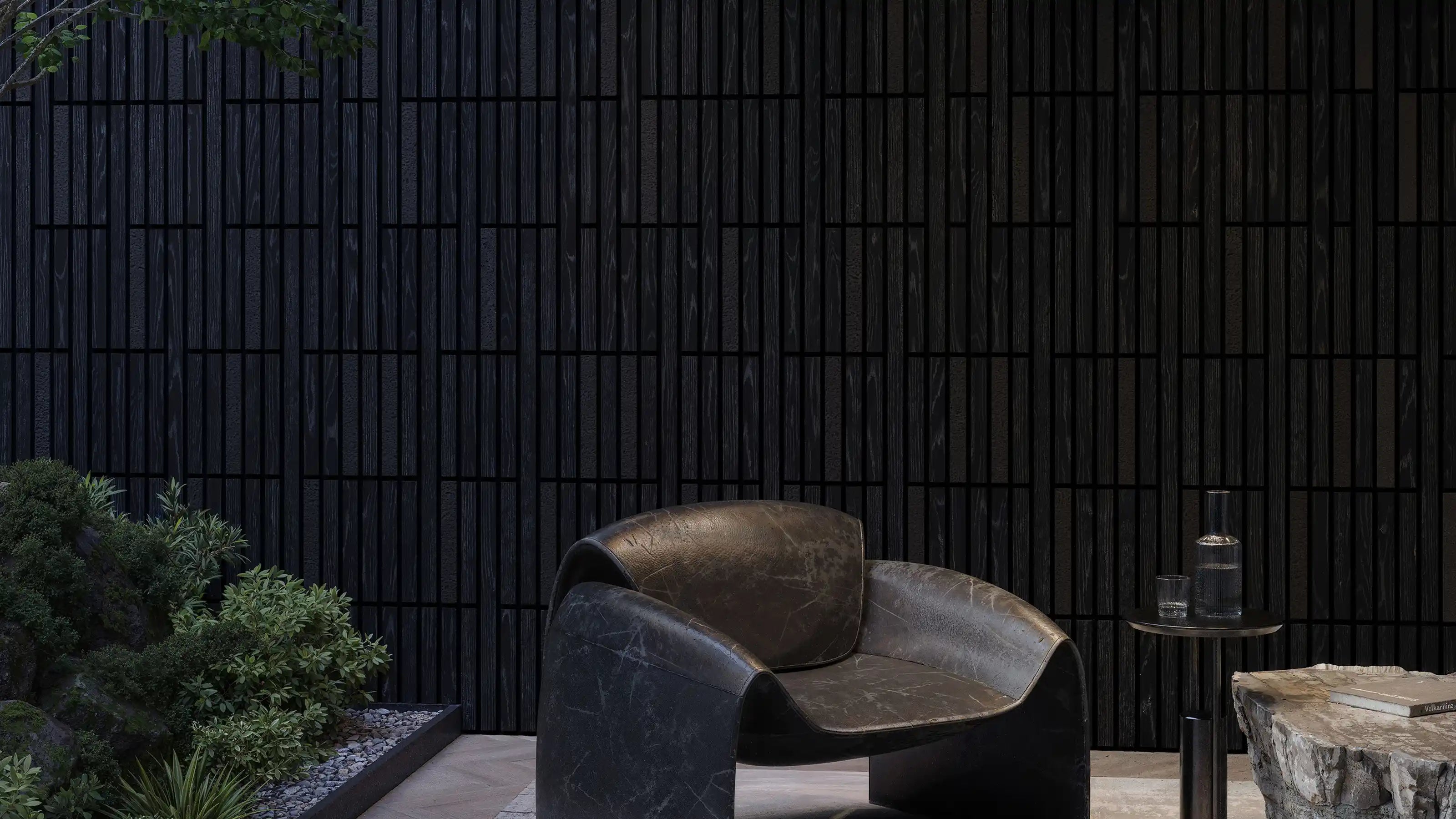 Wood slat wall panels across a full feature wall in a styled living interior