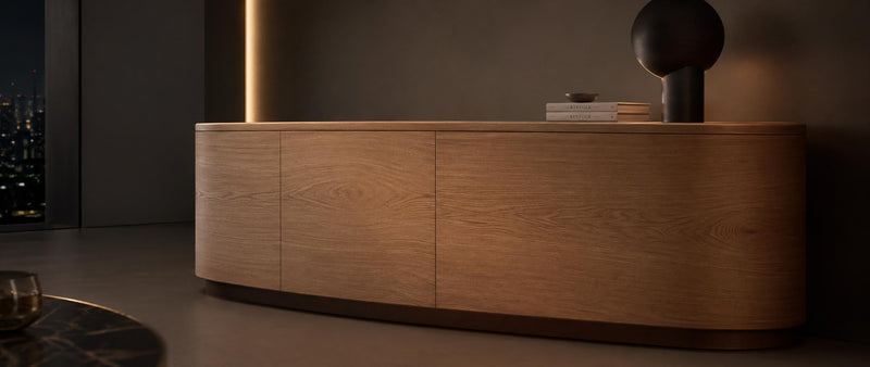 Paper backed flexible wood veneer in oak finish wrapped around a curved surface